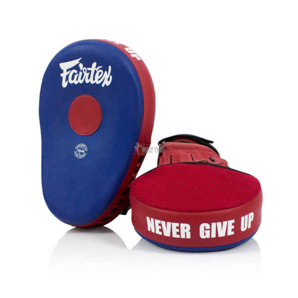 Red and blue Fairtex boxing focus mitts with 'Never Give Up' text on a white background
