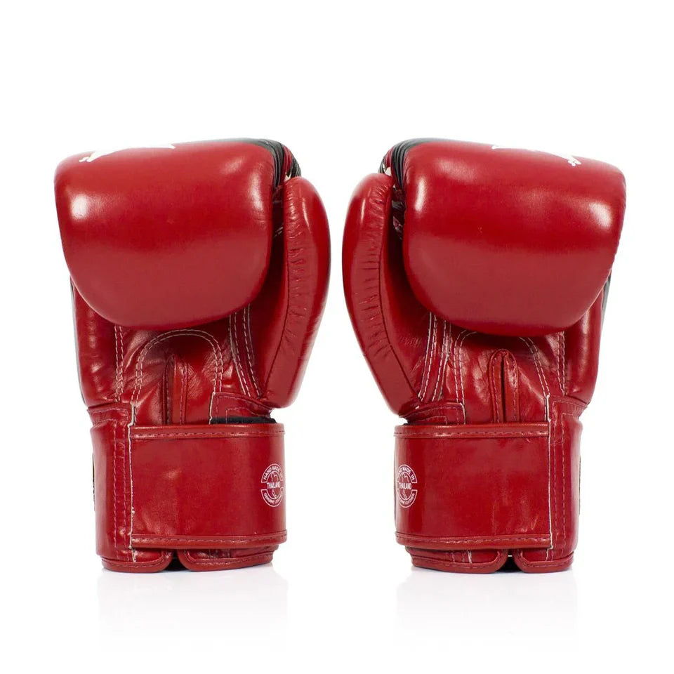 Pair of red boxing gloves on a white background