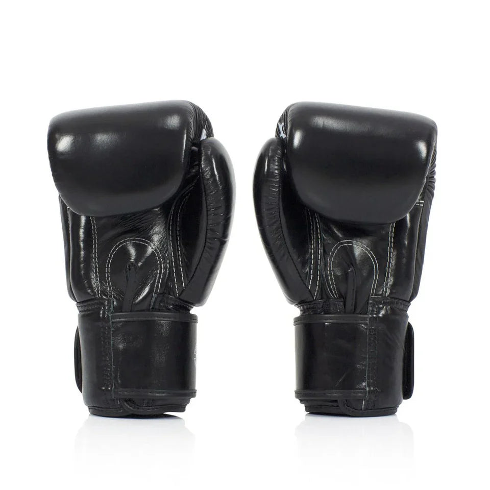 Pair of black boxing gloves on a white background