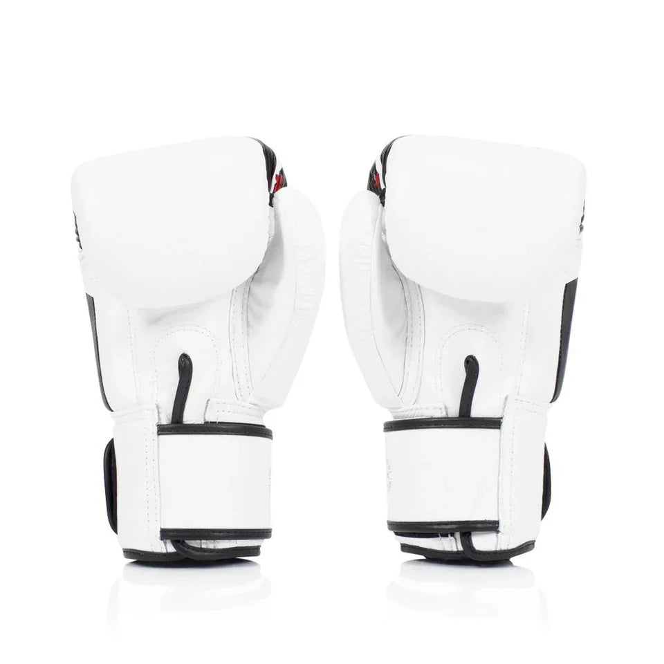 Pair of white boxing gloves with black accents on a white background