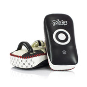Pair of black and white Muay Thai pads with 'Fairtex' branding on a white background.