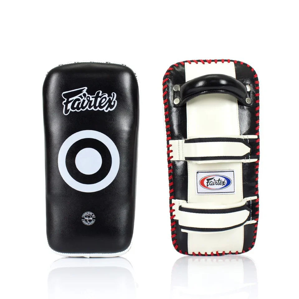 Two Muay Thai pads, one black and one with a red and white design, on a white background.