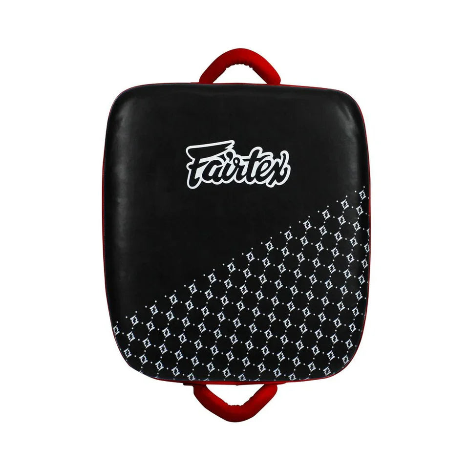 Black and red kick shield with Fairtex logo on a white background