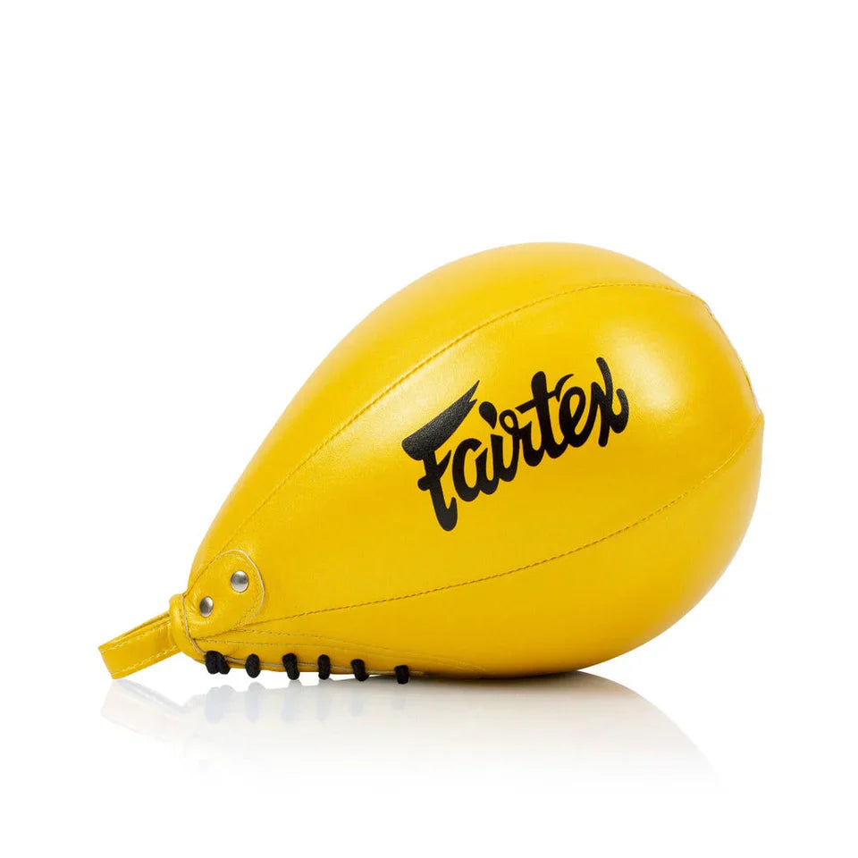 Yellow speed bag with 'Fairtex' branding on a white background