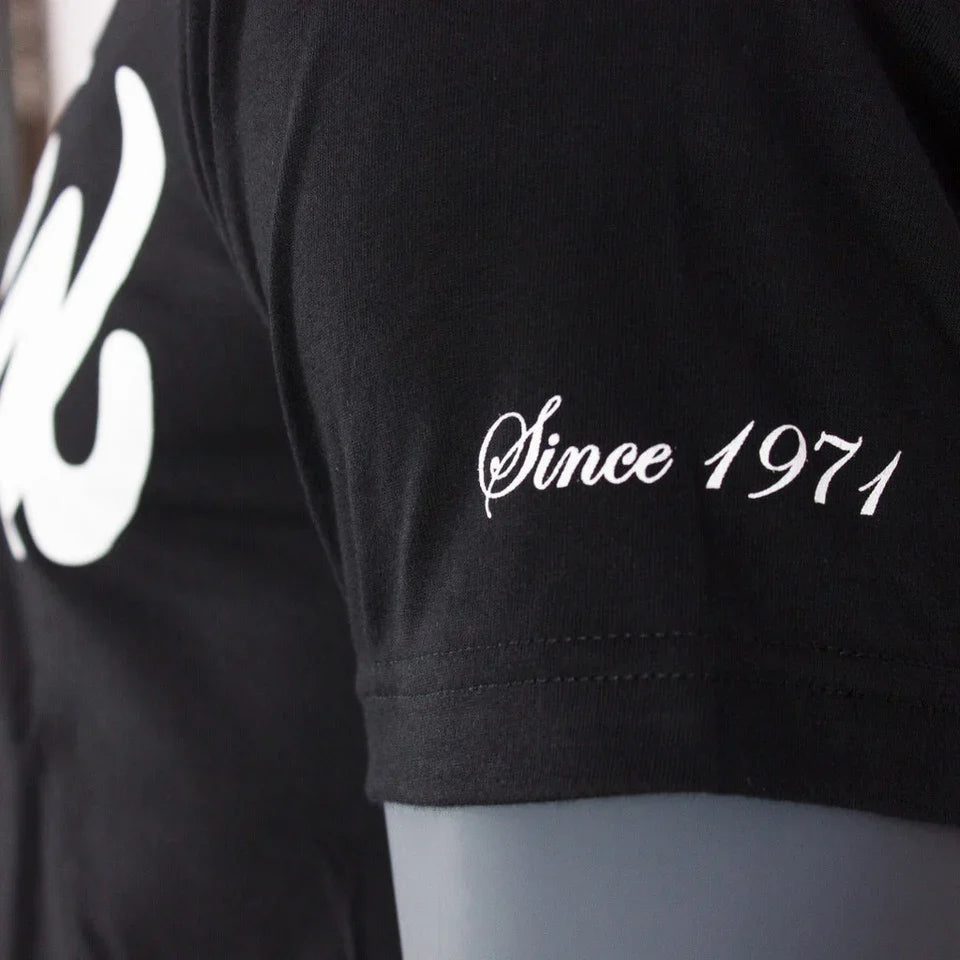 Black t-shirt with white logo and text 'Since 1971' on a gray background