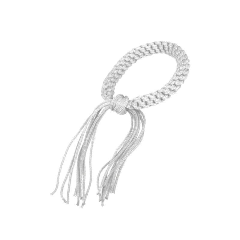 White braided bracelet with tassels on a white background