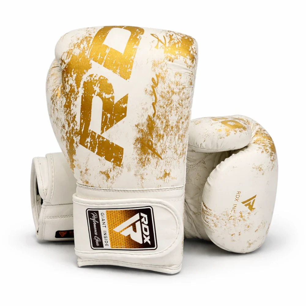 White and gold boxing gloves with RDX logo on a white background