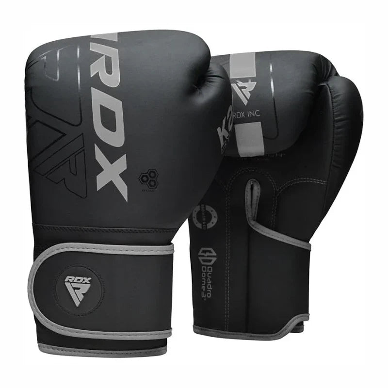 Black boxing gloves with RDX branding on a white background