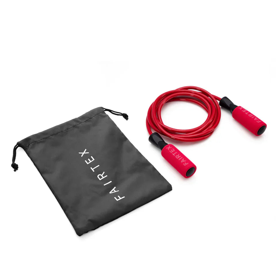Red jump rope with black handles and a black Fairtex drawstring bag on a white background
