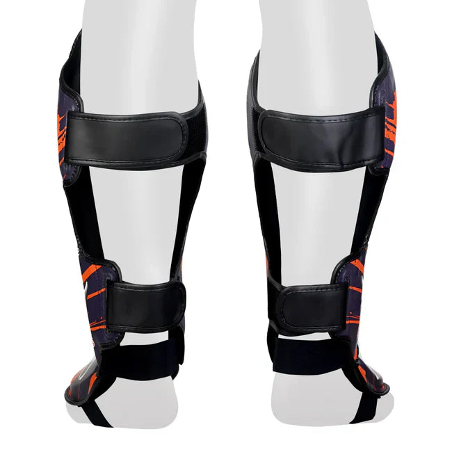 Close up of pull back straps on a pair of Muay Thai shin guards
