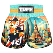 Colourful Thai shorts with a design of a boxer and a temple on a white background