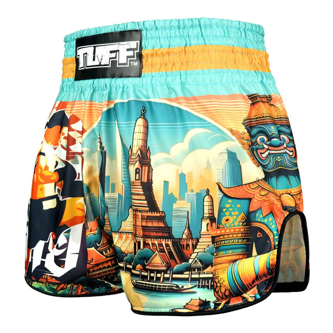 Colourful Muay Thai shorts with a cityscape design and 'TUFF' branding on a white background.