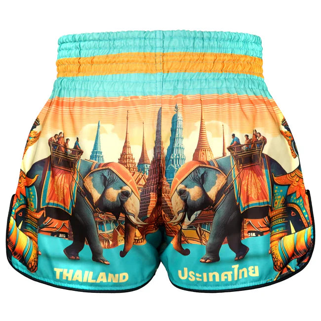 Colourful Thai shorts with elephant and temple design on a white background