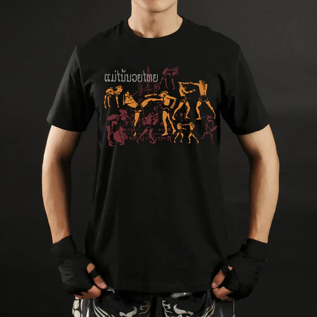 Person wearing a black t-shirt with colorful graphic design on a dark background