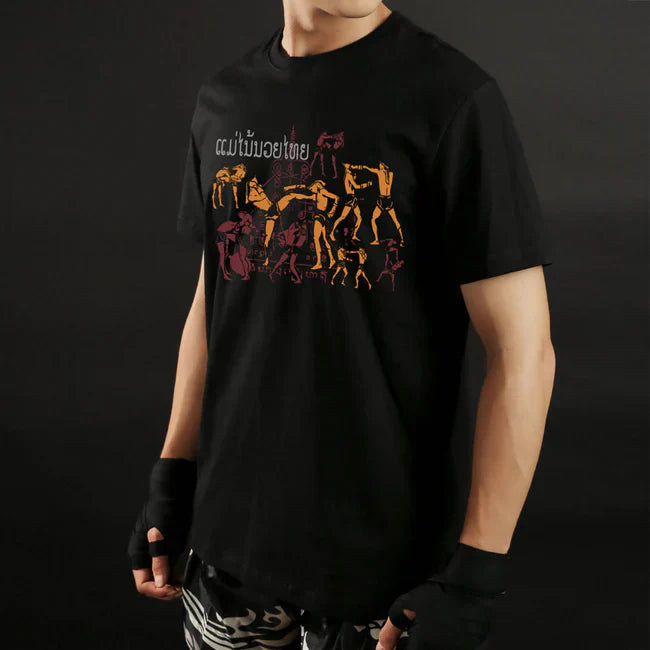 Male wearing a black t-shirt with graphic design on a dark background