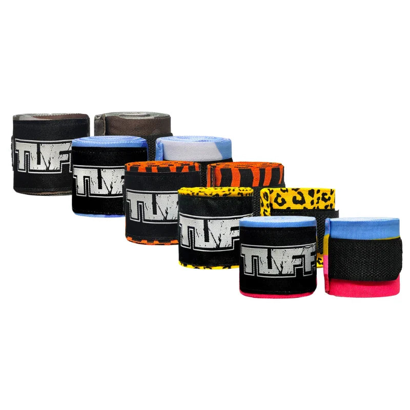 Collection of colorful boxing hand wraps with 'TUFF' branding on a white background