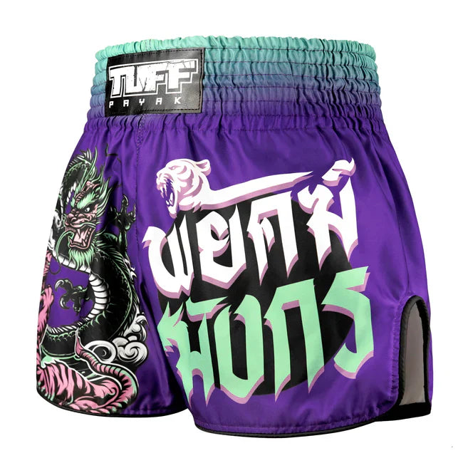 Purple Thai boxing shorts with dragon design and text on a white background