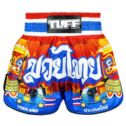 Colourful Muay Thai shorts with traditional design and 'TUFF' brand label on a white background