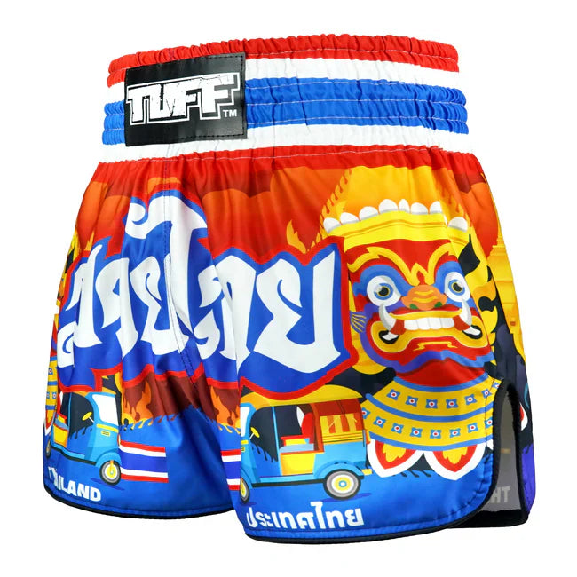 Colourful Thai boxing shorts with a traditional design and 'TUFF' branding on a white background.