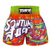 Colorful Thai boxing shorts with graphic designs and 'TUFF PAYAK' branding on a white background