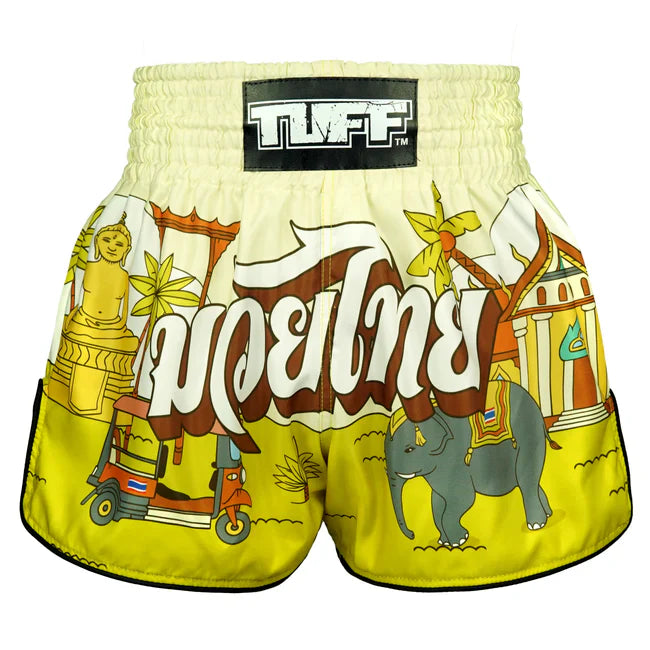 Muay Thai shorts with elephant, scooter, and temple design on a white background