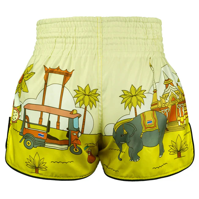 Yellow Muay Thai shorts with elephant and tuk-tuk design on a white background