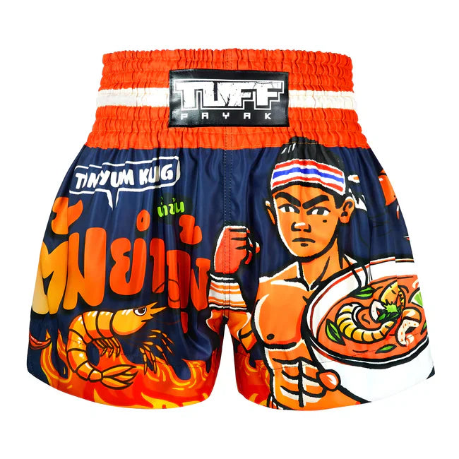 Colourful Muay Thai shorts with a character holding a bowl of soup and text on a white background.