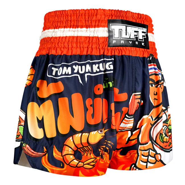 Colorful Thai boxing shorts with 'Tom Yum Kung' design and TUFF Payak branding on a white background.